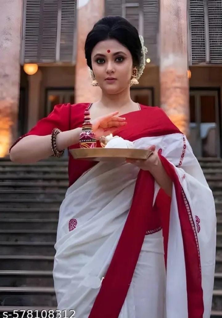 Silk Saree from the adorned with beautiful Zari work in form of traditional motifs